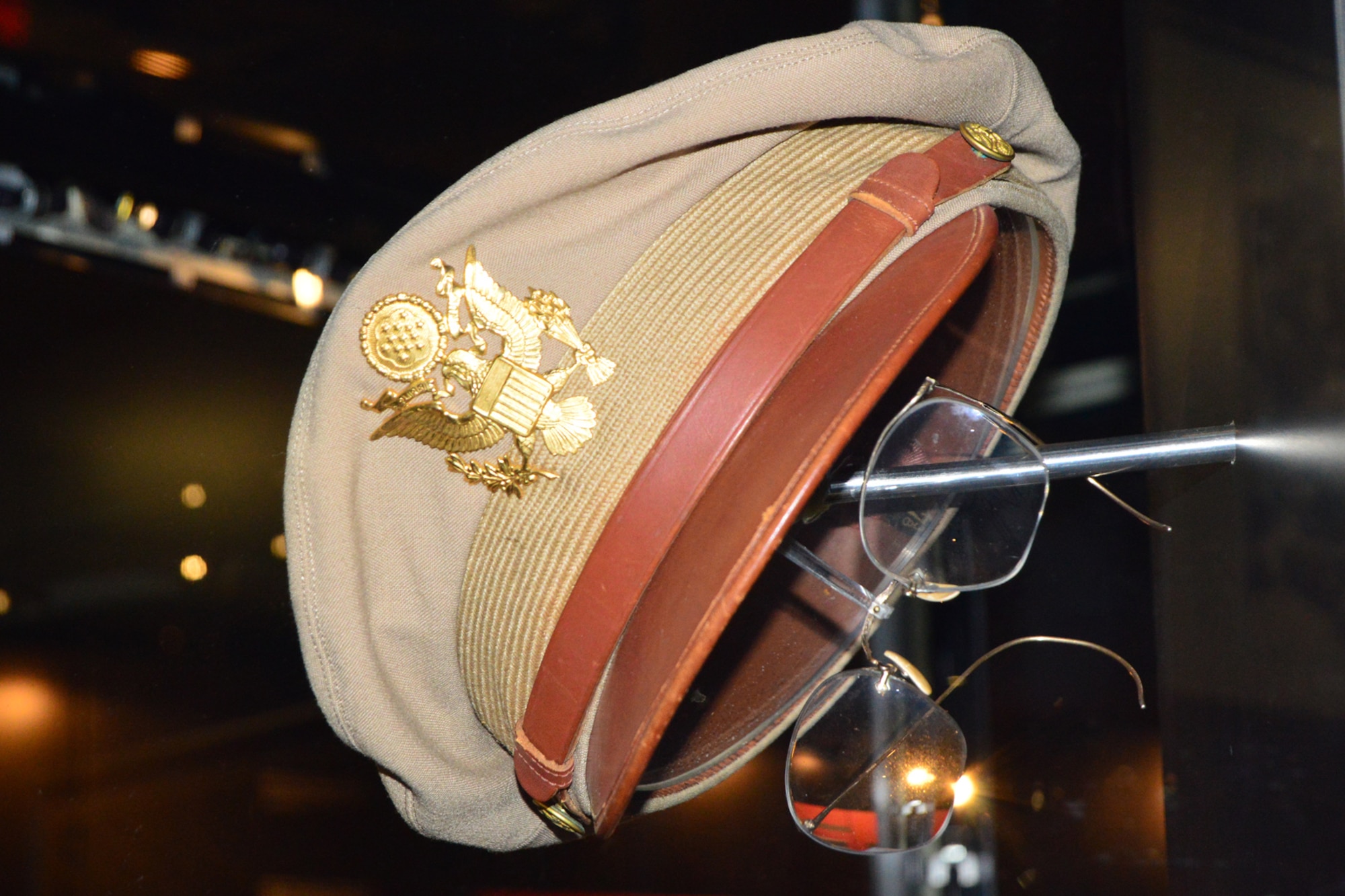 Maj. Glenn Miller's summer uniform cap and spare eyeglasses on display in the World War II Gallery at the National Museum of the United States Air Force. (U.S. Air Force photo)
