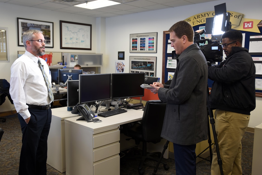 CBS News Reporter Chris Cannon interviews Ben Rohrbach, Nashville District Hydrology and Hydraulics Branch chief, Jan. 4, 2016 in the Water Management Operations Center in Nashville, Tenn.  Rohrbach provided information about the Nashville District’s operations to hold water in the Cumberland River Basin in support of flood operations on the lower Ohio and Mississippi Rivers.