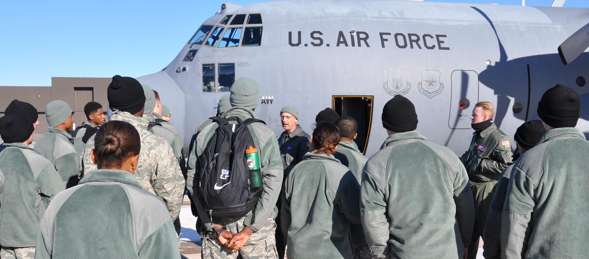 PETERSON AIR FORCE BASE, Colo. – Lt. Col. David Sivinski, center, greets U.S. Air Force Academy Preparatory School students before they tour a 302nd Airlift Wing C-130 Dec. 16, 2015 here. Approximately 210 students spent the afternoon with the wing at the end of their fall semester to learn more about Air Force Reserve missions and career paths. Many of the students will apply to enter the U.S. Air Force Academy next fall with the goal of becoming commissioned officers. Sivinski, a C-130 pilot is the 302nd AW’s Chief of Wing Safety. (U.S. Air Force photo/Daniel Butterfield)
