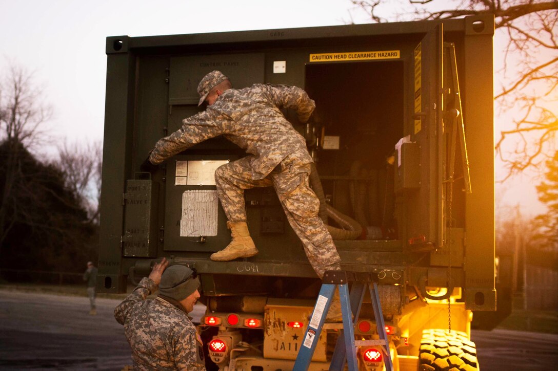 Soldiers conduct a water purification mission in High Ridge, Mo., Jan. 3, 2016. The mission will supply area residents with potable water, which is currently unavailable due to flooding. The soldiers are assigned to the 334th Brigade Support Battalion. U.S. Army photo by Cpl. Harold Flynn