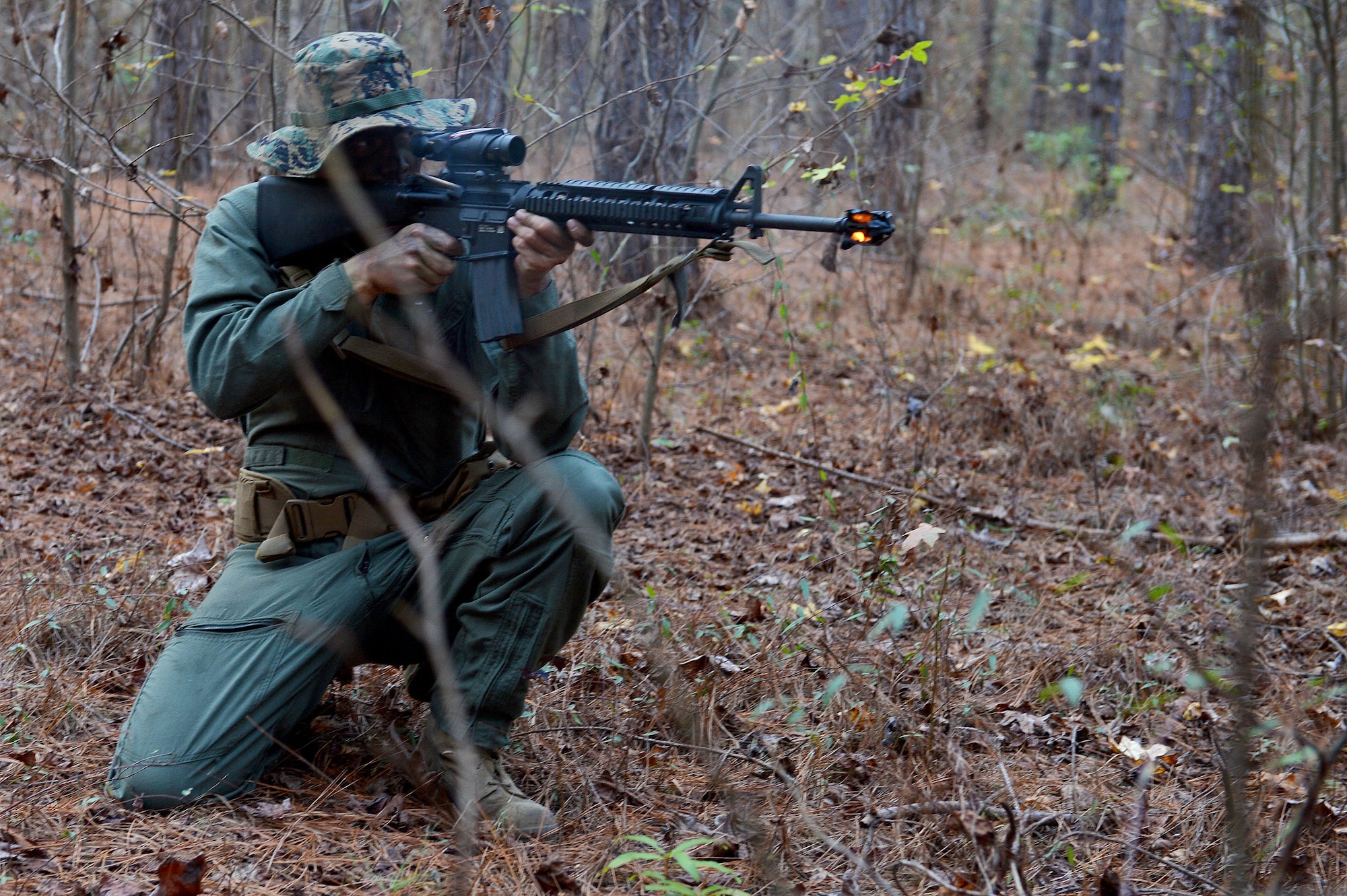 A U.S. Marine assigned to Marine Aviation Logistics Squadron 31 stationed at Marine Corps Air Station Beaufort, S.C., engages Marine Wing Support Squadron 273’s front lines at Poinsett Electronic Combat Range, Wedgefield, S.C., Dec. 10, 2015. The MALS 31 Marines would assault, testing the readiness and reaction of the MWSS 273’s security team. (U.S. Air Force photo by Senior Airman Diana Cossaboom)