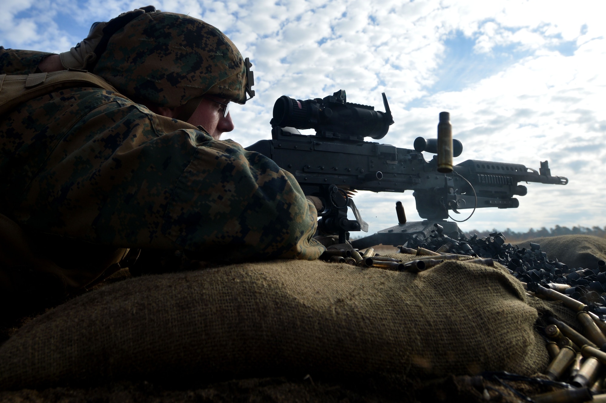 A U.S. Marine assigned to Marine Wing Support Squadron 273 stationed at Marine Corps Air Station Beaufort, S.C., fires an M240 machine gun at Poinsett Electronic Combat Range, Wedgefield, S.C., Dec. 9, 2015. To ensure the unit is mission ready at a moment’s notice, the squadron came to the range for a week-long exercise to hone their combat capabilities. (U.S. Air Force photo by Senior Airman Michael Cossaboom)