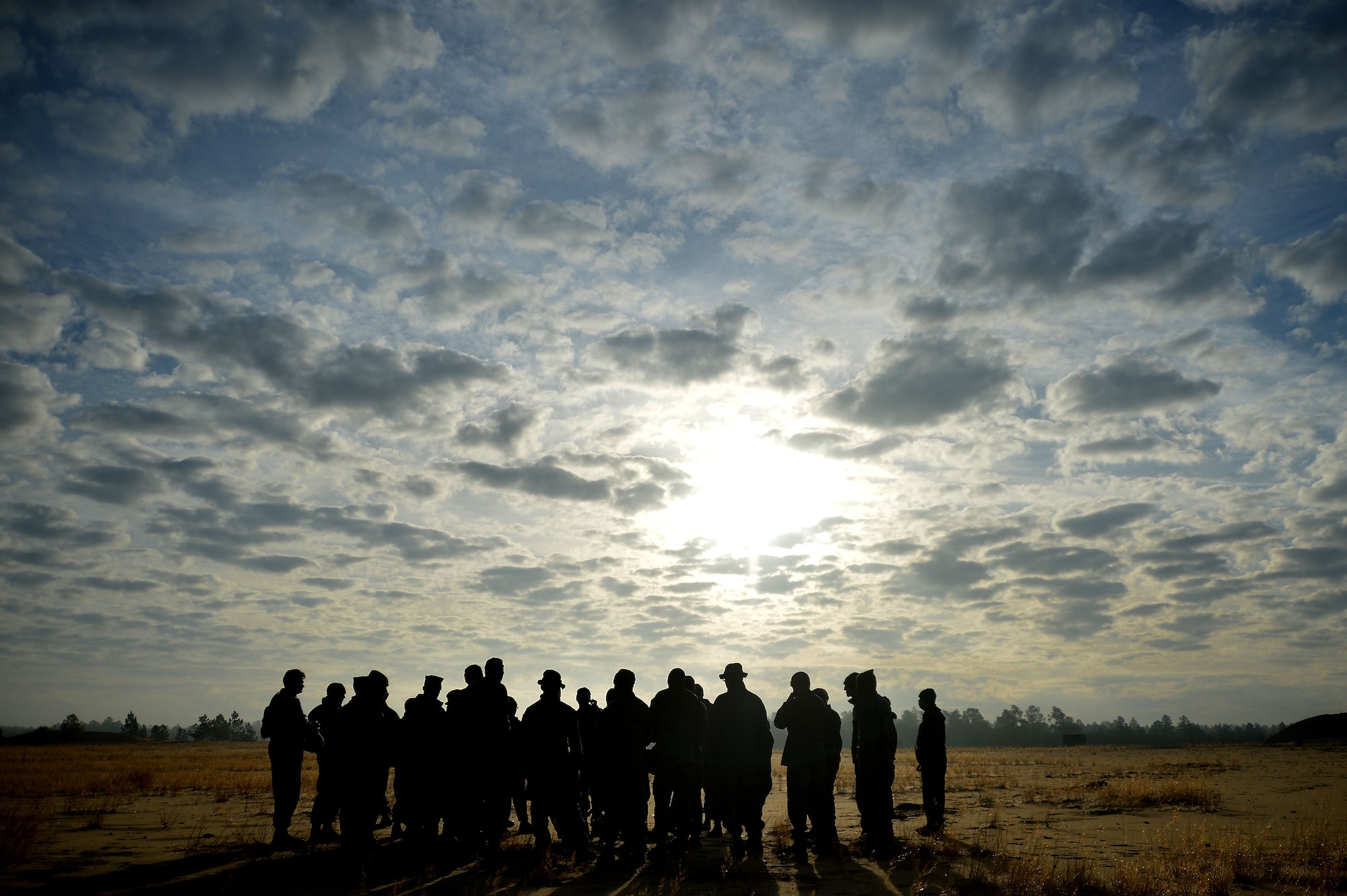 U.S. Marines assigned to Marine Wing Support Squadron 273 stationed at Marine Corps Air Station Beaufort, S.C., gather for a range briefing at Poinsett Electronic Combat Range, Wedgefield, S.C., Dec. 9, 2015. While on the Range, the Marines practiced shooting various weapons to hone their marksmanship abilities. (U.S. Air Force photo by Senior Airman Michael Cossaboom)