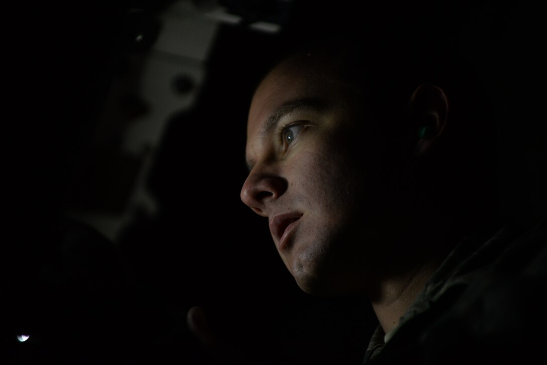 Senior Airman Tyler Pipkins, 28th Aircraft Maintenance Squadron weapons load crew member, secures a B-1 bomber munition at Ellsworth Air Force Base, S.D., Dec. 8, 2015. Personnel, like Pipkins, verify each loading step has been correctly executed for safe munition deployment. (U.S. Air Force photo by Airman Sadie Colbert/Released)
