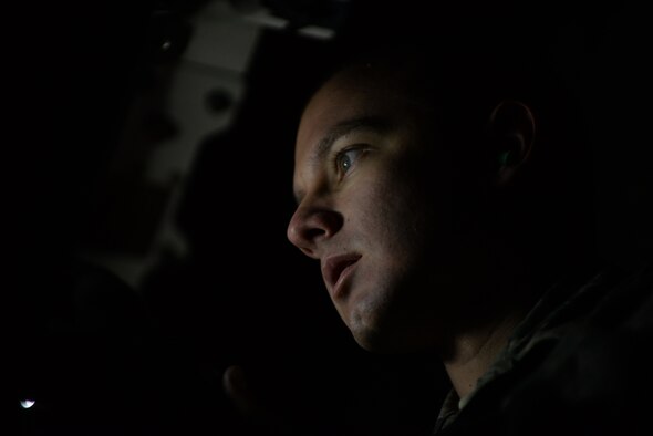 Senior Airman Tyler Pipkins, 28th Aircraft Maintenance Squadron weapons load crew member, secures a B-1 bomber munition at Ellsworth Air Force Base, S.D., Dec. 8, 2015. Personnel, like Pipkins, verify each loading step has been correctly executed for safe munition deployment. (U.S. Air Force photo by Airman Sadie Colbert/Released)