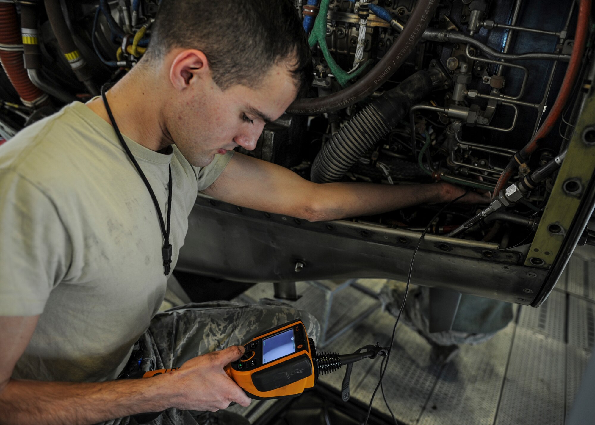 U.S. Air Force Senior Airman Cory Poff, 19th Maintenance Squadron aerospace propulsion journeyman, uses a borescope to inspect the inside of a C-130J engine Dec. 29, 2015, at Little Rock Air Force Base, Ark. Borescopes allow Airmen to see a real-time video view of hard-to-reach areas inside various aircraft components. (U.S Air Force photo/Senior Airman Harry Brexel)