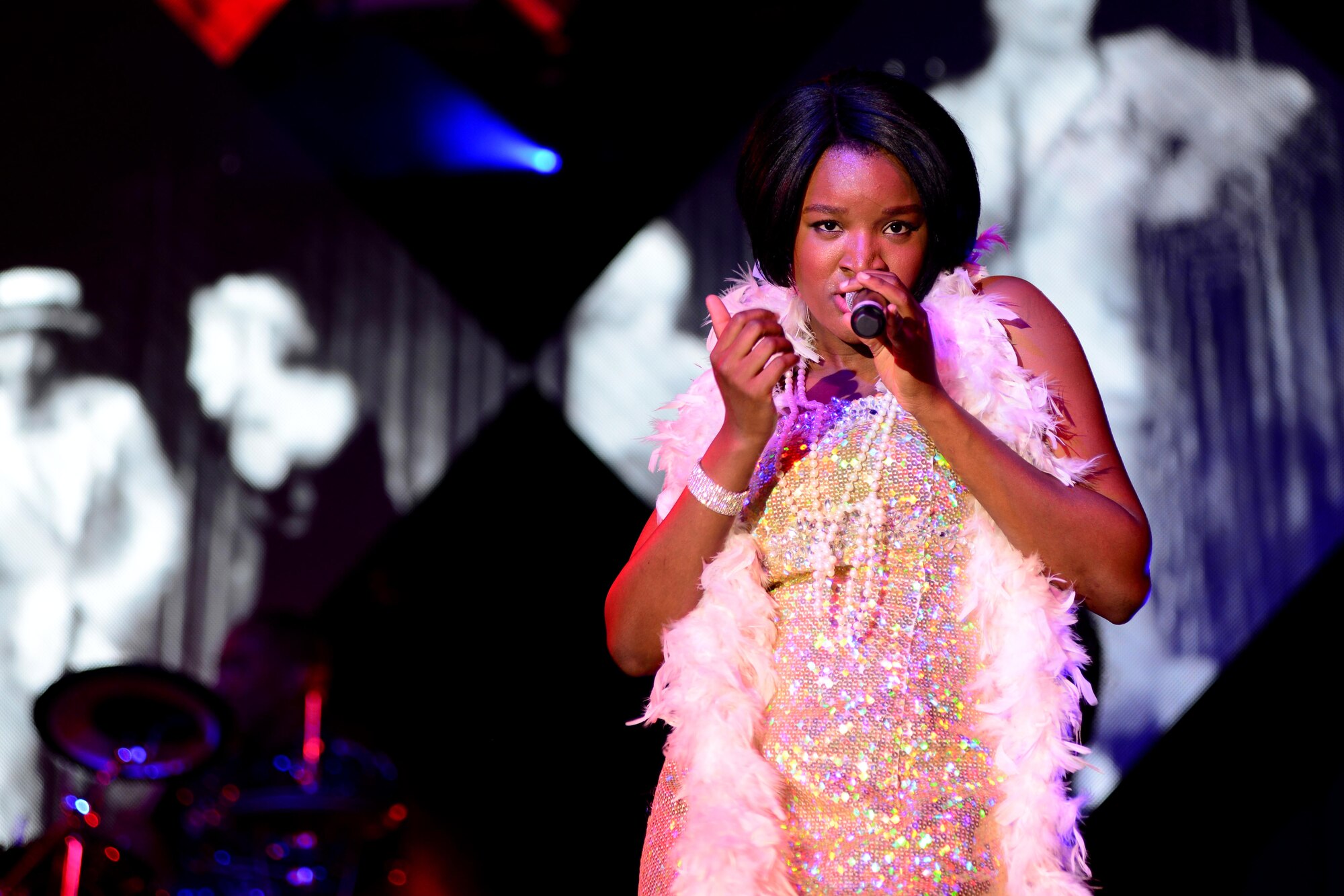 U.S. Air Force Staff Sgt. Sherita Tisdom, Tops in Blue vocalist, performs during a Tops in Blue show, Jan. 4, 2016, at Aviano Air Base, Italy. This year’s tour included songs from several artists, including Ricky Martin, Bruno Mars and Meghan Trainor. (U.S. Air Force photo by Senior Airman Areca T. Bell/Released)