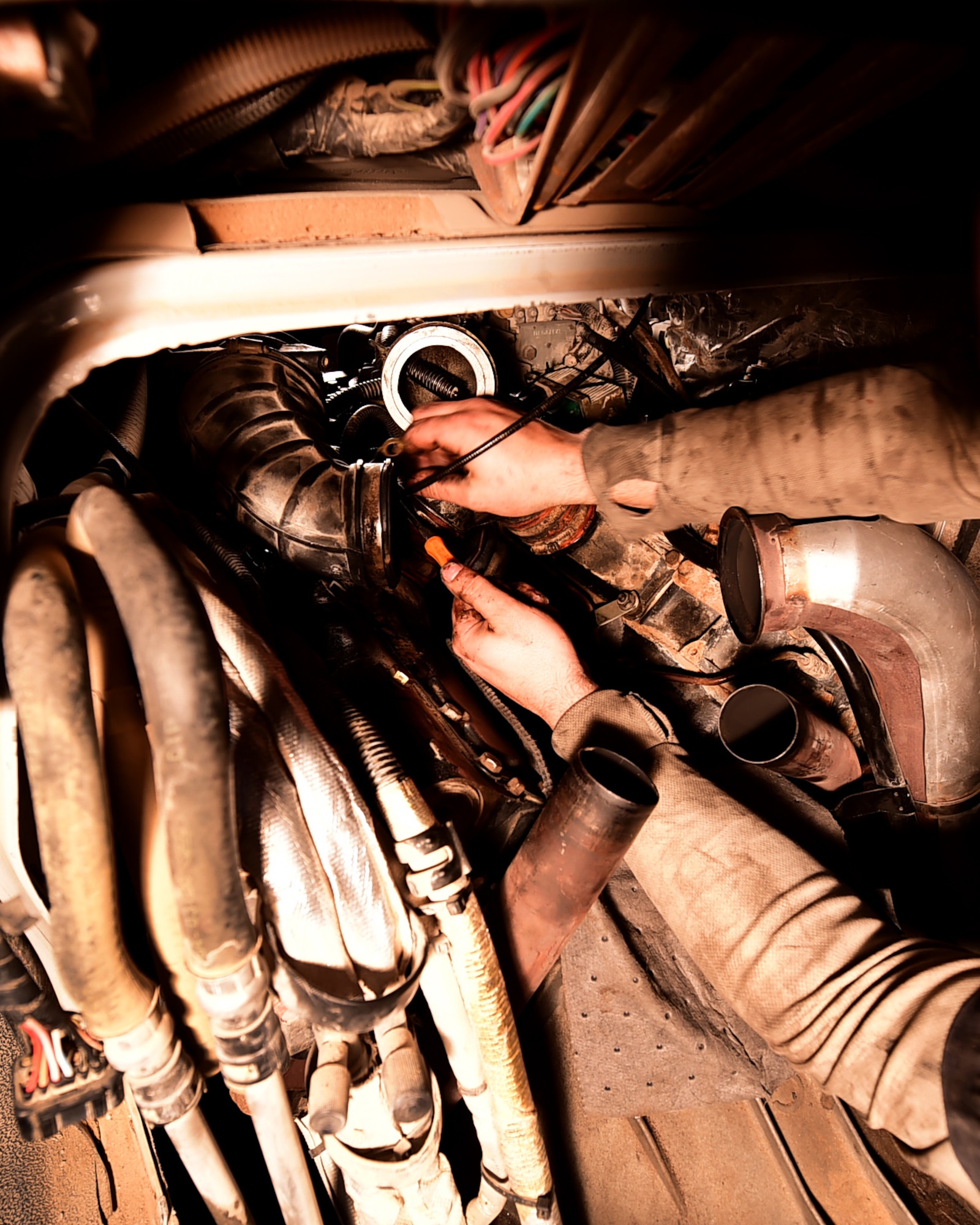 Staff Sgt. Joseph Petrie, 386th Vehicle Management Flight, mission generation vehicular equipment maintenance journeyman, replaces a vehicle injection control pump at an undisclosed location in Southwest Asia, Jan. 4, 2016. The vehicle management flight maintains a fleet of more than 700 vehicles including construction equipment and general purpose vehicles supporting Operation INHERENT RESOLVE. (U.S. Air Force photo by Staff Sgt. Jerilyn Quintanilla)