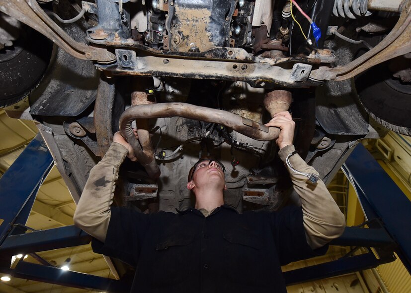 Senior Airman Troy Noel, 386th Vehicle Management Flight, mission generation vehicular equipment maintenance journeyman, inspects a vehicle clearance prior to mounting a new transmission at an undisclosed location in Southwest Asia, Jan. 4, 2016, supporting Operation INHERENT RESOLVE. The vehicle management flight conducts all repairs necessary for the safe operation of vehicles such as oil changes, engine and transmission replacements, and annual vehicle servicing. (U.S. Air Force photo by Staff Sgt. Jerilyn Quintanilla)