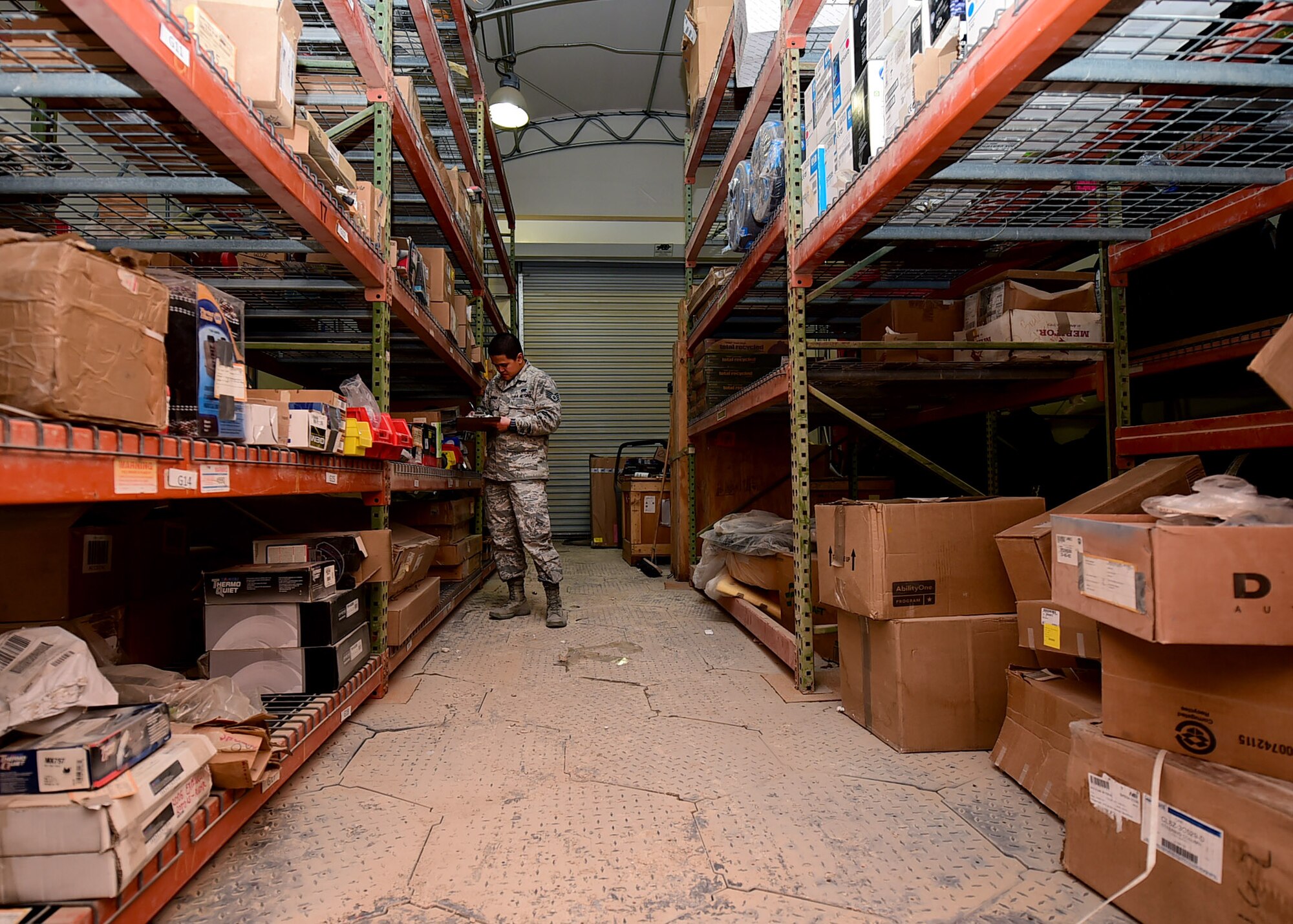 Staff Sgt. Jennifer Panican, 386th Expeditionary Logistics Readiness Squadron materiel control NCO in charge, conducts a parts inventory at an undisclosed location in Southwest Asia, Jan. 4, 2016. The material management flight purchases, maintains and tracks all vehicle parts necessary to maintain the fleet supporting Operation INHERENT RESOLVE. (U.S. Air Force photo by Staff Sgt. Jerilyn Quintanilla)
