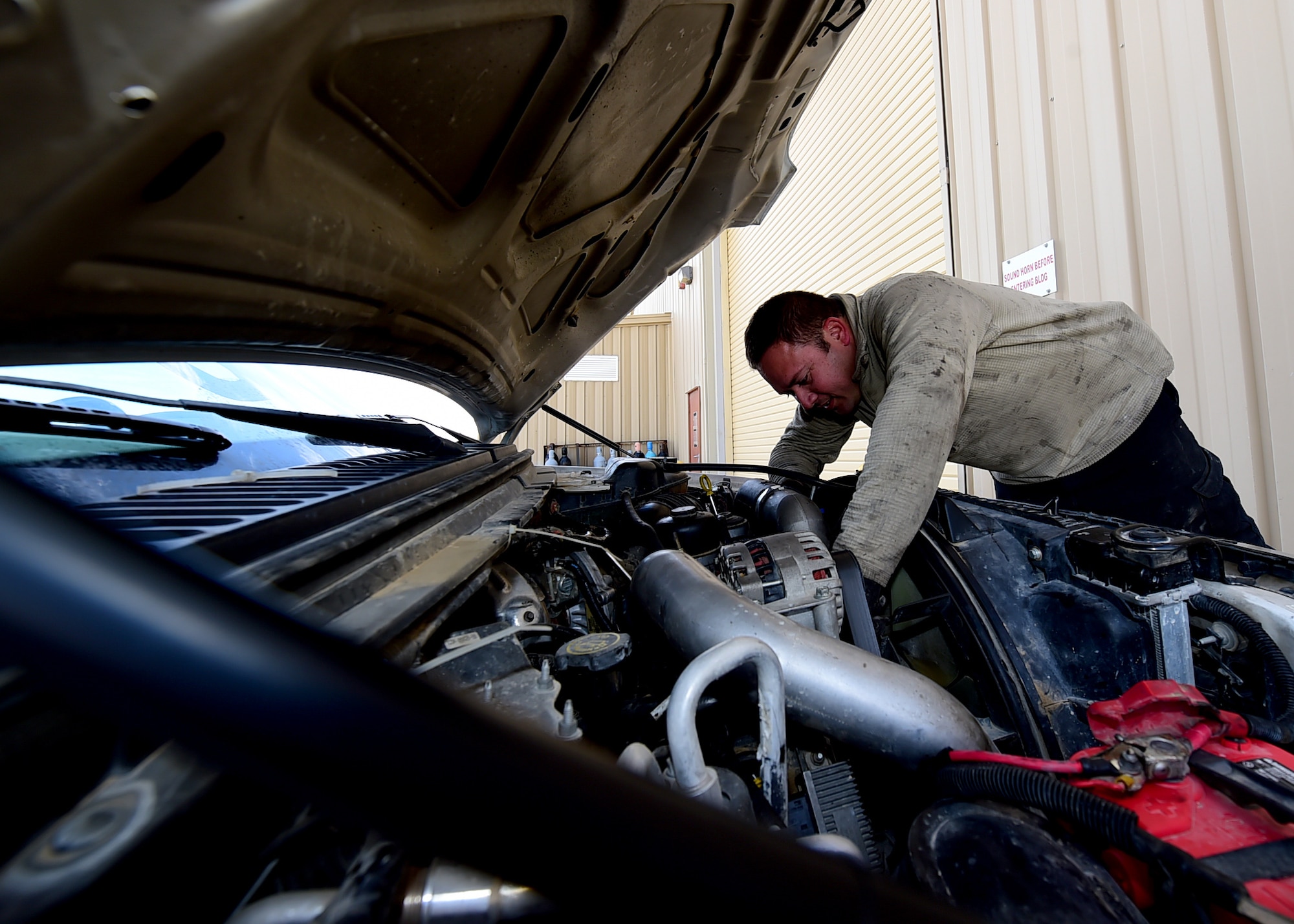 Staff Sgt. Justin Gentry, 386th Vehicle Management Flight, mission generation vehicular equipment maintenance journeyman, inspects a vehicle prior to conducting regularly scheduled maintenance at an undisclosed location in Southwest Asia, Jan. 4, 2016 supporting Operation INHERENT RESOLVE. The vehicle management flight performs regularly scheduled maintenance on more than 700 vehicles throughout the 386th Air Expeditionary Wing. (U.S. Air Force photo by Staff Sgt. Jerilyn Quintanilla)