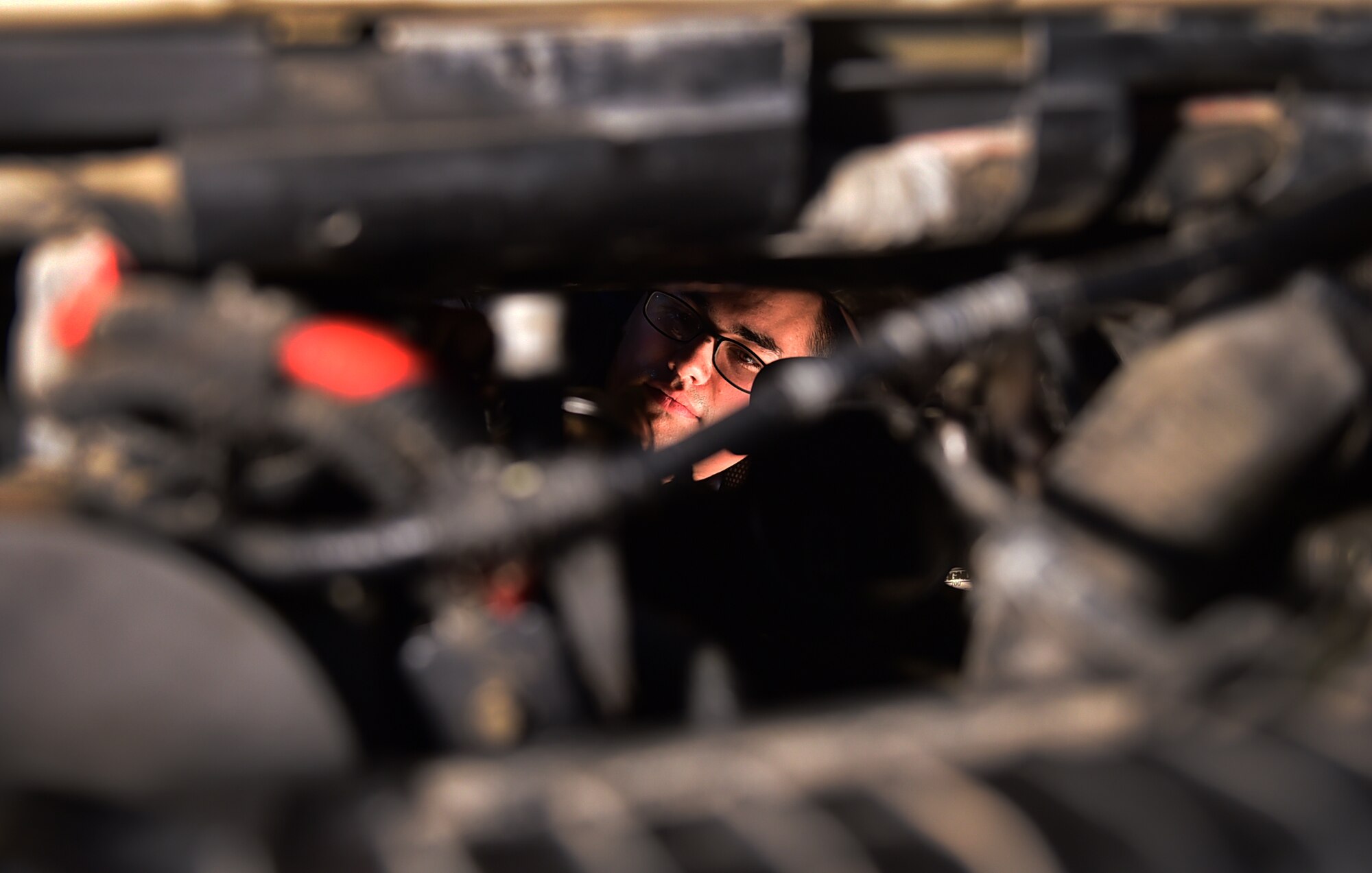 Staff Sgt. Joseph Petrie, 386th Vehicle Management Flight, mission generation vehicular equipment maintenance journeyman, replaces a vehicle injection control pump at an undisclosed location in Southwest Asia, Jan. 4, 2016 supporting Operation INHERENT RESOLVE. The 386th vehicle management flight performs all repairs necessary for the safe operation of motor vehicles such as oil changes, replacing engines and transmissions of general purpose trucks and cars, fire trucks, cargo loaders, and aircraft refueling vehicles. (U.S. Air Force photo by Staff Sgt. Jerilyn Quintanilla)