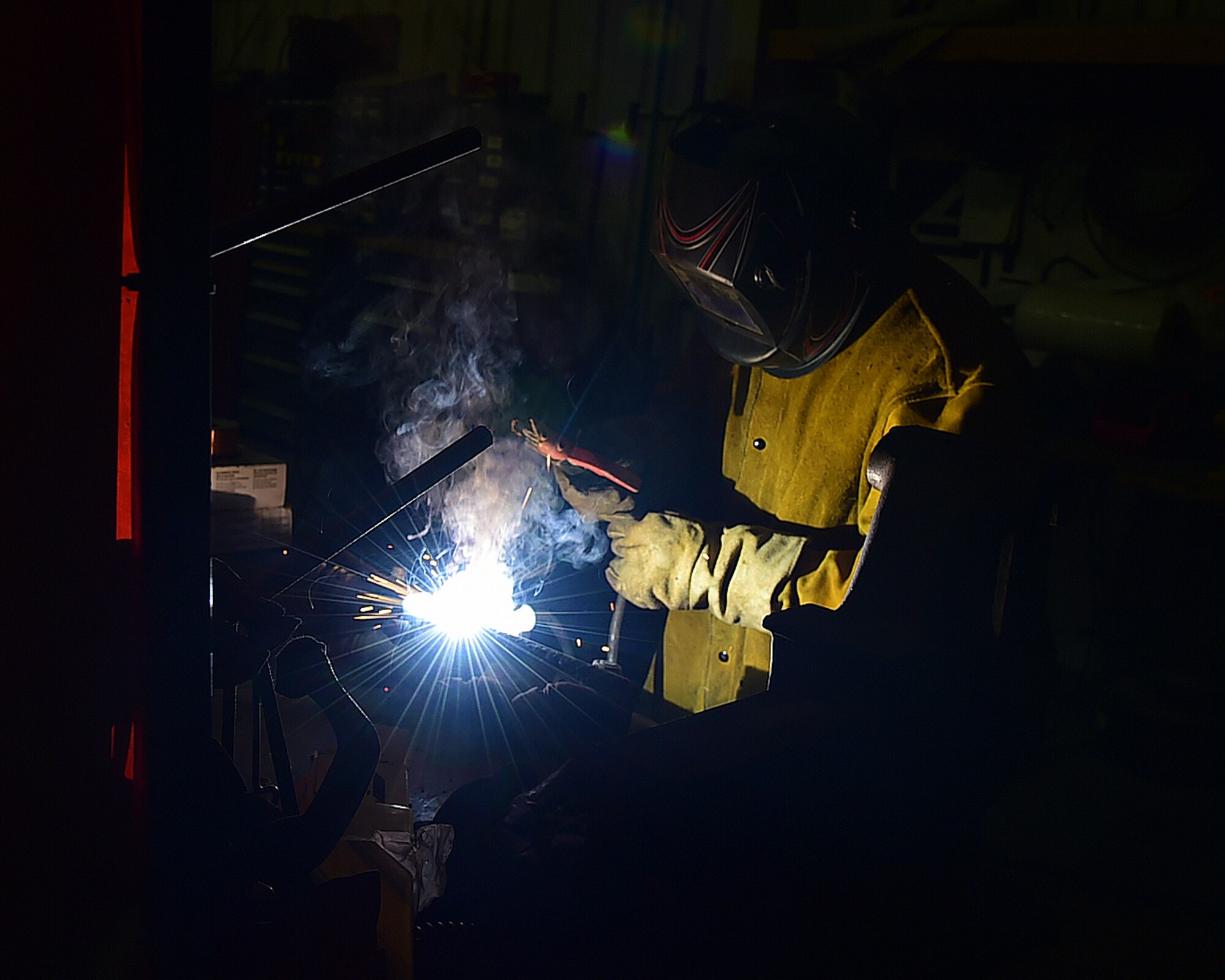Staff Sgt. Rodel Lalap, 386th Vehicle Management Flight, mission generation vehicular equipment maintenance journeyman, welds digging blades for reuse at an undisclosed in Southwest Asia, Jan. 4, 2016 supporting Operation INHERENT RESOLVE. The flight’s welding capabilities enable them to repair cracked vehicle panels, damaged construction equipment and steel construction frames. They are also able to make custom tools when needed. (U.S. Air Force photo by Staff Sgt. Jerilyn Quintanilla)
