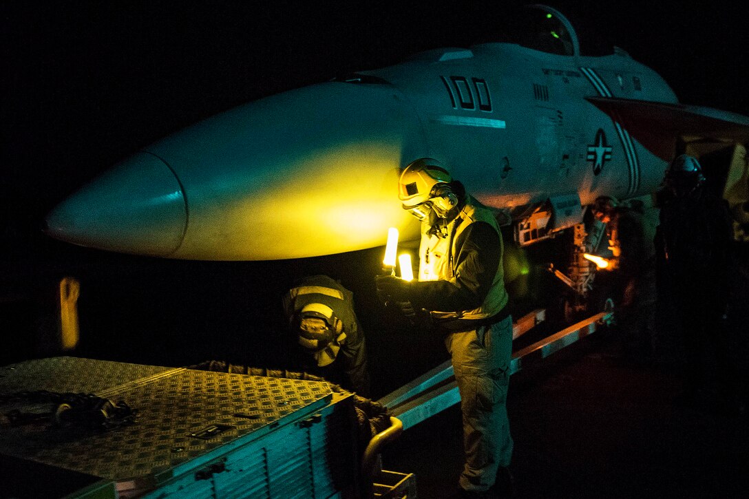 U.S. sailors prepare to move an F/A-18E Super Hornet on the flight deck of the aircraft carrier USS Harry S. Truman in the Arabian Gulf, Jan. 4, 2016. The Harry S. Truman Carrier Strike Group is deployed in support of Operation Inherent Resolve and other security efforts in the U.S. 5th Fleet area of responsibility. U.S. Navy photo by Petty Officer 3rd Class B. Siens