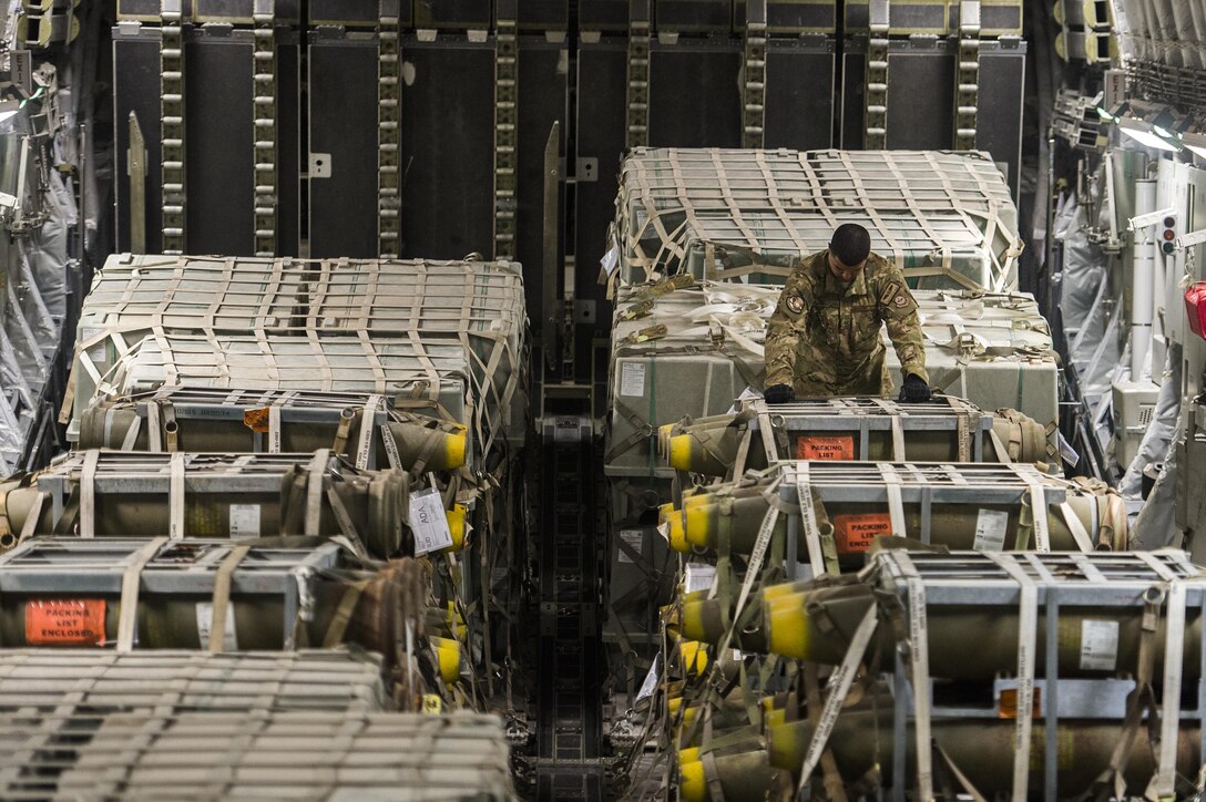 U.S. Air Force Staff Sgt. Curtis Sibby prepares cargo for travel at Al Udeid Air Base, Qatar, in support of Operation Inherent Resolve, Dec. 22, 2015. Sibby is a loadmaster assigned to the 816th Expeditionary Airlift Squadron loadmaster. U.S. Air Force photo by Tech. Sgt. Nathan Lipscomb