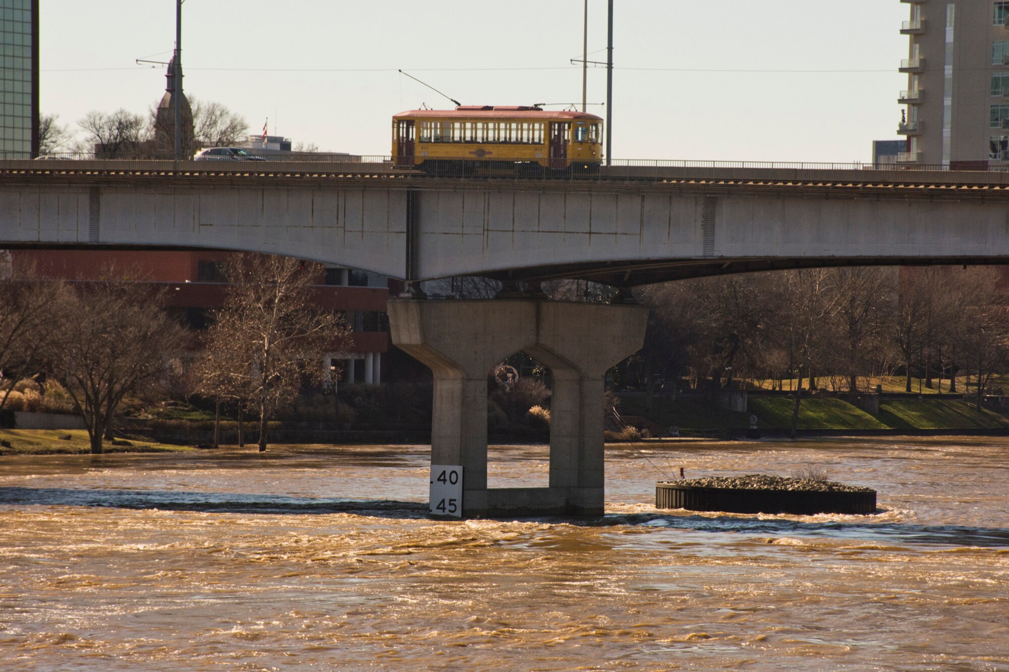 A River Rail Electric Streetcar crosses over the Arkansas River on the Main Street Bridge from Little Rock to North Little Rock Ark., Jan. 3, 2016. Recent flooding in Arkansas could set records, and everyone is encouraged to stay off the rivers, which include the Arkansas, Buffalo and White rivers until further notice. (Courtesy photo by Jeff Walston) 