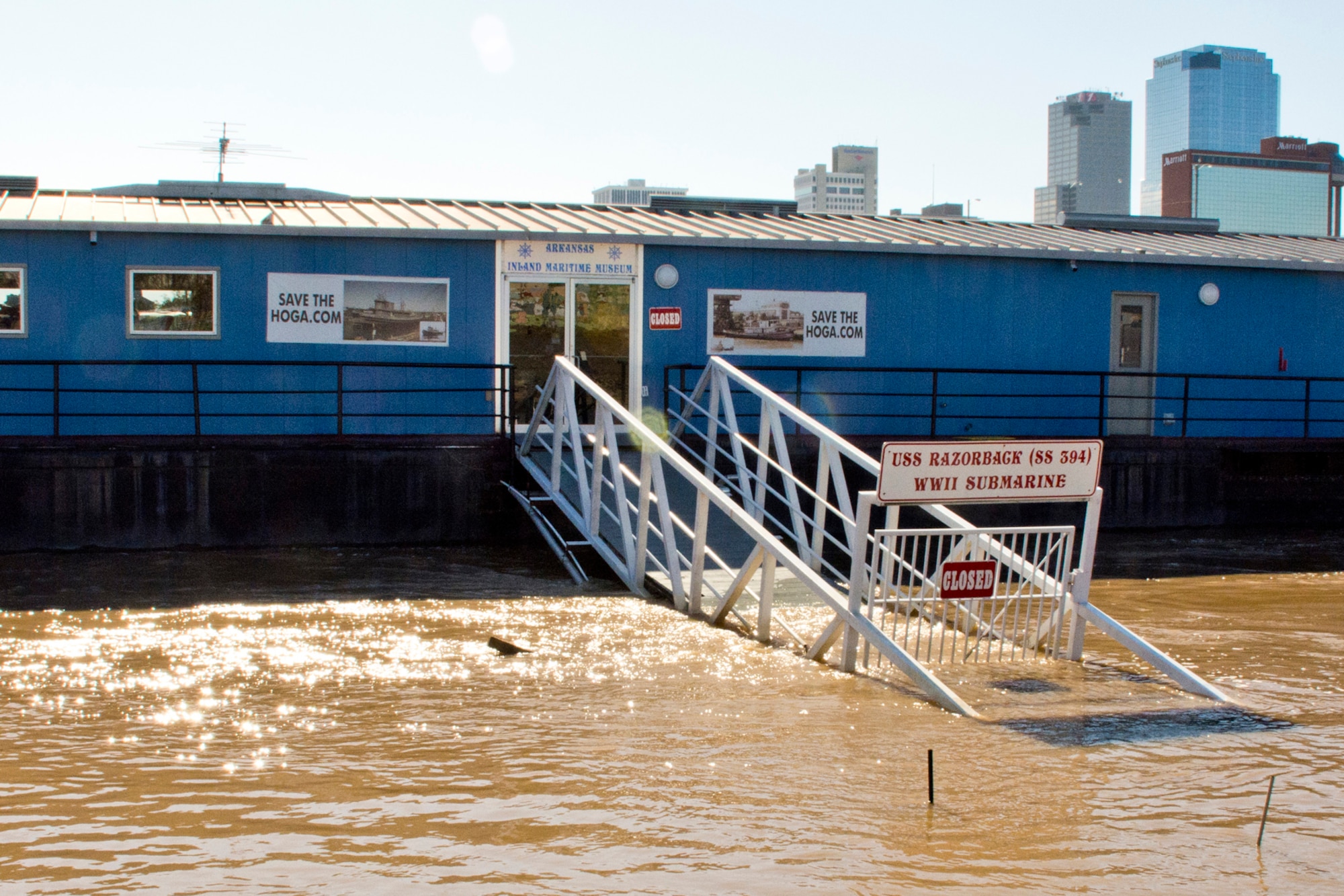 The Arkansas Inland Maritime Museum’s main entrance is underwater due to flooding from the Arkansas River in North Little Rock, Ark., Jan. 3, 2016. The floating museum, as well as its main attractions, the USS Razorback (SS-394) and the USS Hoga (YT-146) did not sustain major damage during the recent flooding of the Arkansas River. Recent flooding in Arkansas could set records, and everyone is encouraged to stay off the rivers, which include the Arkansas, Buffalo and White rivers until further notice. (Courtesy photo by Jeff Walston)