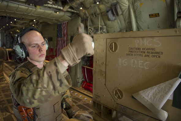 Staff Sgt. Justin King, a 774th Expeditionary Airlift Squadron loadmaster, gives a thumbs-up as a generator is offloaded from a C-130J Super Hercules at Camp Bastion, Afghanistan, Jan. 3, 2016. Loadmasters are responsible for calculating aircraft weight, balancing records and cargo manifests, conducting cargo and personnel airdrops, and troubleshooting in-flight problems. King is deployed from Dyess Air Force Base, Texas. (U.S. Air Force photo/Tech. Sgt. Robert Cloys)