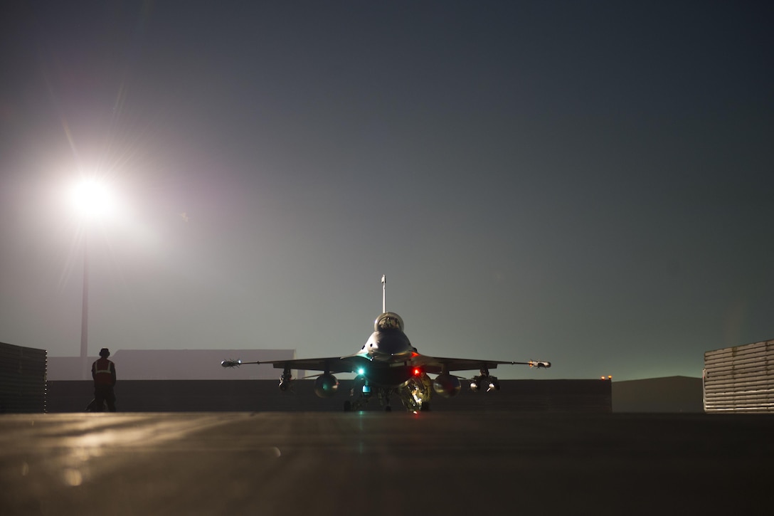 An F-16 Fighting Falcon aircraft passes through a safety and arming check on Bagram Airfield after supporting ground operations over Helmand province, Afghanistan, Jan. 6, 2016. U.S. Air Force photo by Tech. Sgt. Robert Cloys