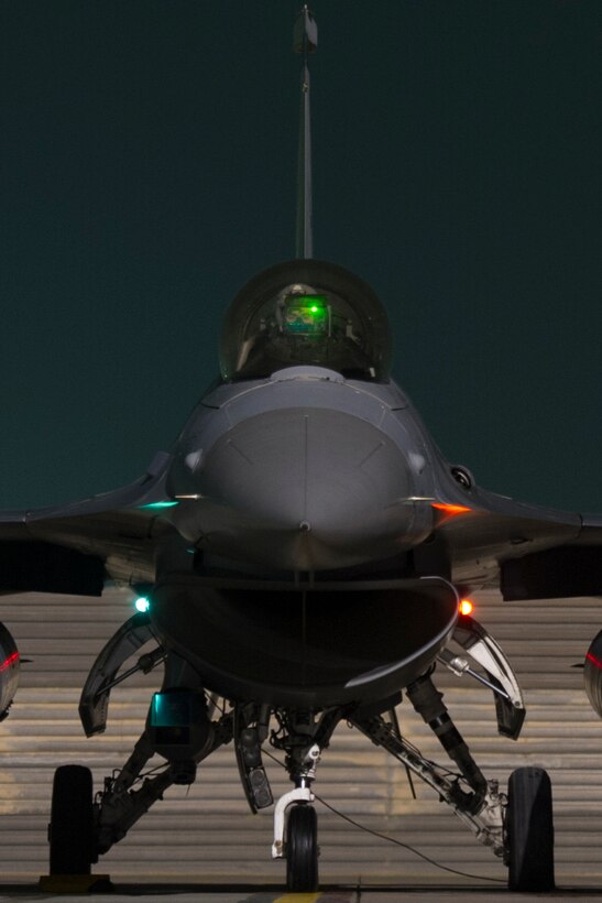 An F-16 Fighting Falcon aircraft finishes final checks on Bagram Airfield before departing on a sortie in support of ground operations in Helmand province, Afghanistan, Jan. 6, 2016. U.S. Air Force photo by Tech. Sgt. Robert Cloys