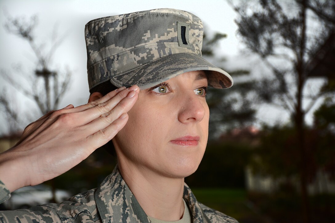 1st. Lt. Heather Bradley, 349 AMW/EO shows a proper salute. Saluting is one of the oldest military courtesies. While outdoors, uniformed Airmen, including those wearing the PT uniform, must render a salute to commissioned officers and warrant officers of superior rank. (U.S. Air Force photo by Ken Wright)