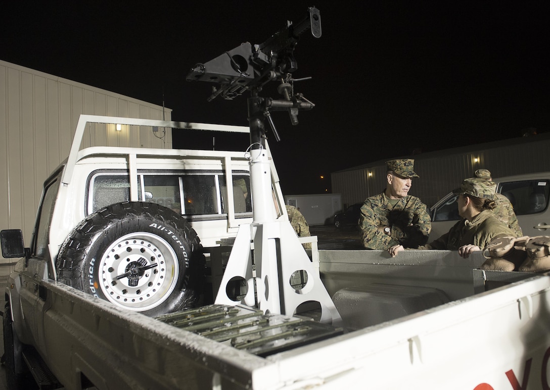 U.S. Marine Corps Gen. Joseph F. Dunford Jr., left, chairman of the Joint Chiefs of Staff, speaks with U.S. Army Cpt. Amanda Wielgus, right, assigned to Combined Joint Special Operations Task Force, about trucks modified for combat operations on Incirlik Air Base, Turkey, Jan. 6, 2016. DoD photo by Navy Petty Officer 2nd Class Dominique A. Pineiro