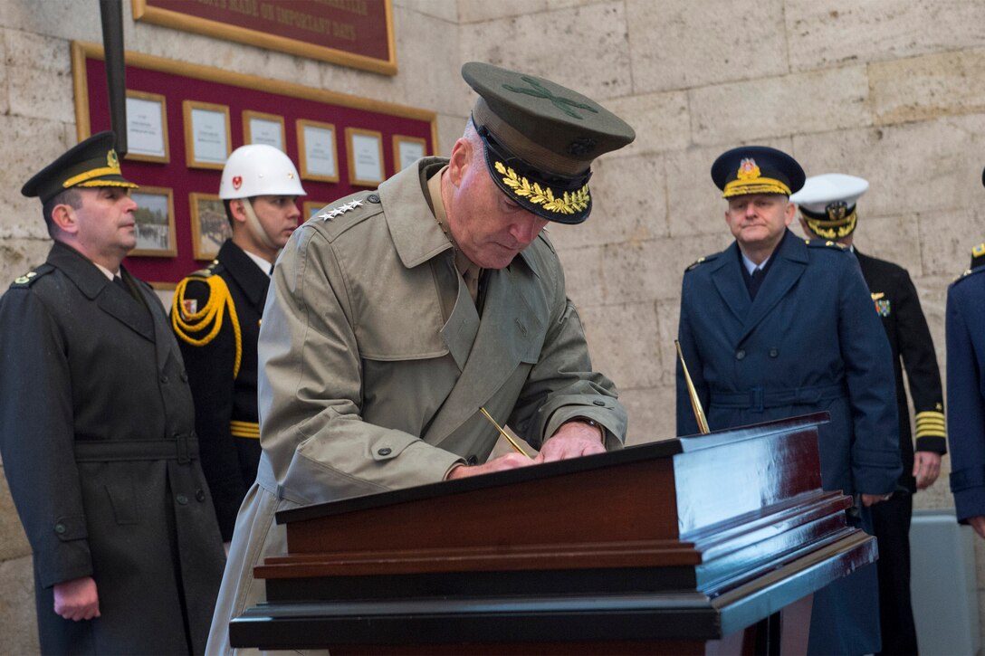 U.S. Marine Corps Gen. Joseph F. Dunford Jr., chairman of the Joint Chiefs of Staff, signs a guestbook following a wreath-laying ceremony at the museum at Anitkabir Cenotaph in Ankara, Turkey, Jan. 6, 2016. DoD photo by Navy Petty Officer 2nd Class Dominique A. Pineiro