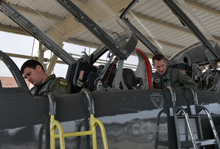 Capt. Chris Umphres (right), 435th Fighter Training Squadron flight commander and instructor pilot, prepares for take-off in a T-38 with First Lt. Kaleb Jenkins, 435th FTS student pilot, before a training mission Jan. 5 at Joint Base San Antonio-Randolph, Texas. (U.S. Air Force photo by Tech. Sgt. Beth Anschutz)