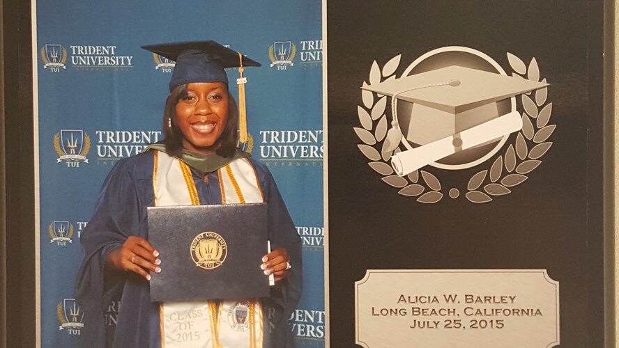 Master Sgt. Alicia Barley, Community College of the Air Force regional manager, poses for a photo after receiving her Master of Science in Health Administration degree from Trident University in 2015. Sergeant Barley graduated with honors, Magna Cum Laude, while continuing her job serving Airmen at Air University. (U.S. Air Force courtesy photo)
