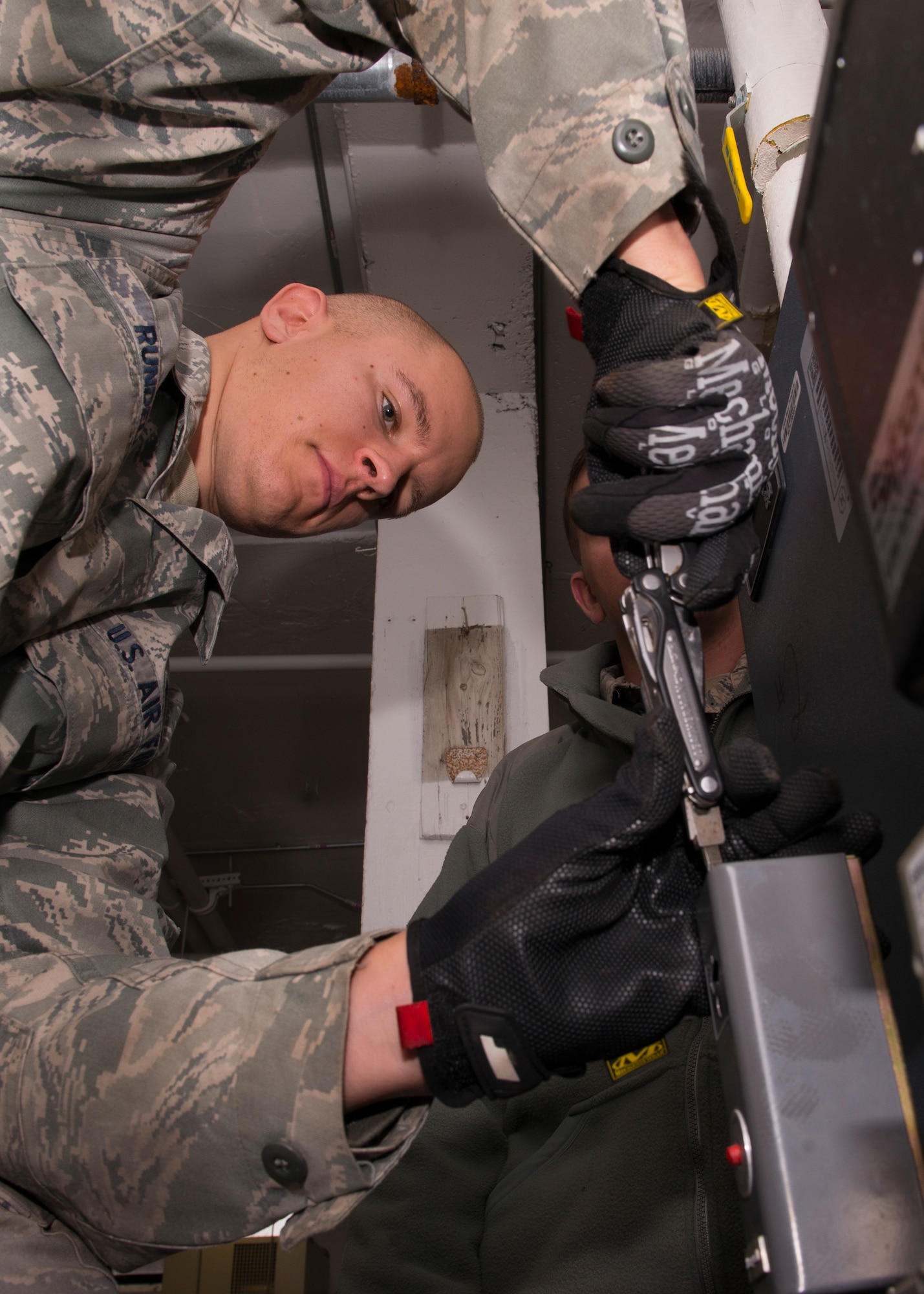 U.S. Air Force Staff Sgt. Chris Rundell, Heating Ventilation and Air Conditioning (HVAC) craftsmen assigned to the 633rd Civil Engineer Squadron, removes a panel from an HVAC system at Langley Air Force Base, Va., Jan. 5, 2016. Rundell assisted with the completion of three different HVAC system work orders in the first half of his day. (U.S. Air Force by Staff Sgt. J.D. Strong II)
