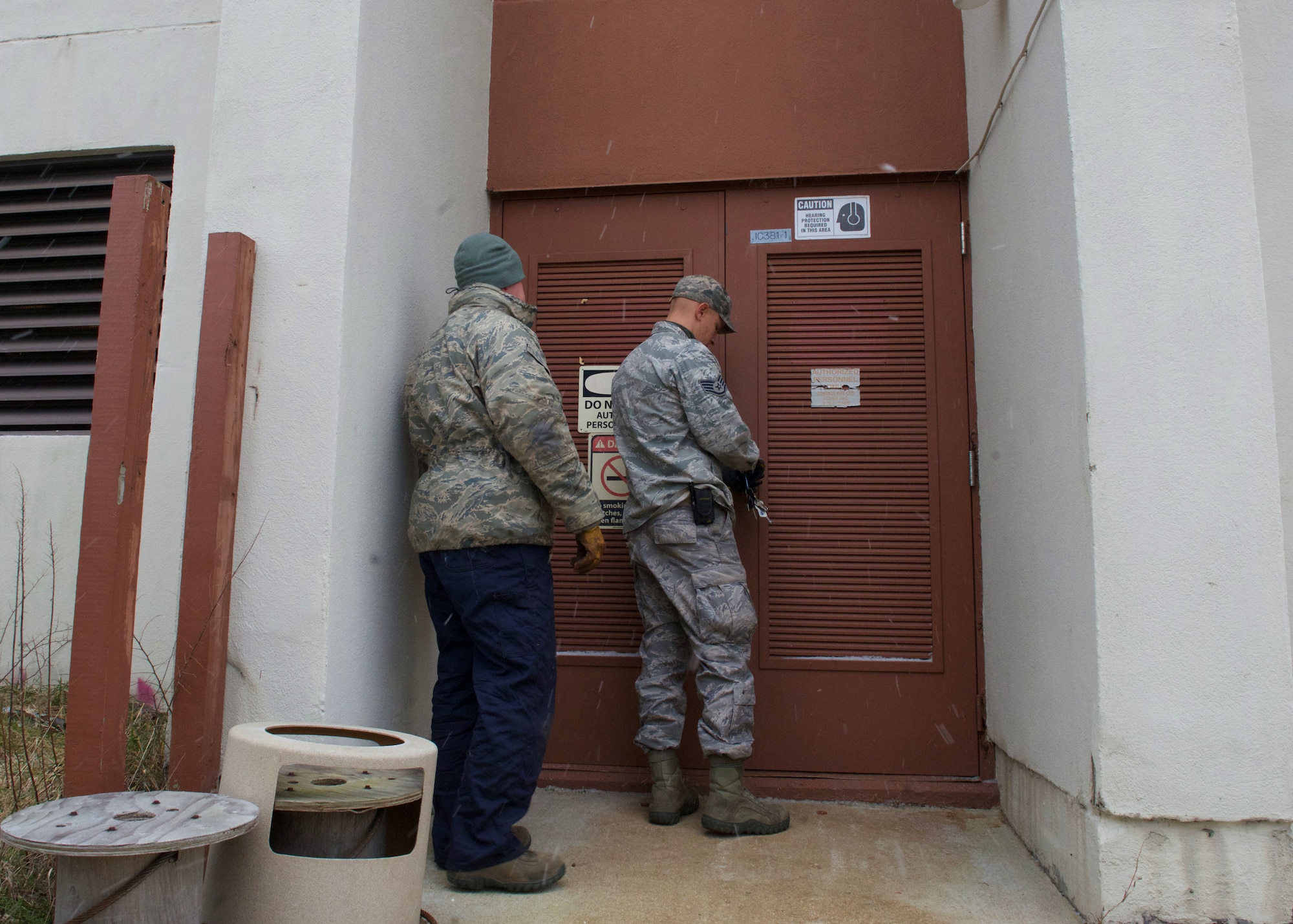 U.S. Air Force Staff Sgts. Will Davey and Chris Rundell, Heating Ventilation and Air Conditioning (HVAC) craftsmen assigned to the 633rd Civil Engineer Squadron, gain access to a maintenance room at Langley Air Force Base, Va.,  Jan. 5, 2016. Davey and Rendell fixed an HVAC system, ensuring personnel had heat to perform their mission in a comfortable environment. (U.S. Air Force by Staff Sgt. J.D. Strong II)