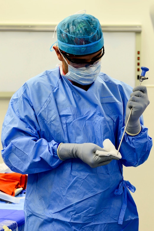 U.S. Air Force Airman 1st Class Gustavo Lombana, 633rd Medical Group surgical technician, cleans a camera scope at Langley Air Force Base, Va., Oct. 27, 2015. The scope allows a surgeon to see inside of a patient without causing major damage. (U.S. Air Force photo by Airman 1st Class Derek Seifert)