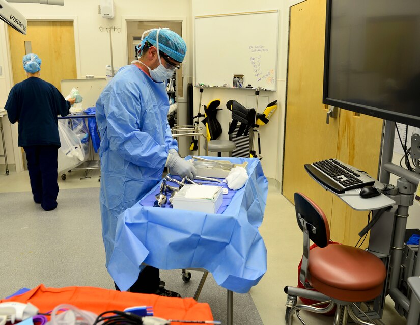 U.S. Air Force Airman 1st Class Gustavo Lombana, 633rd Medical Group surgical technician, organizes the “clean table” before an operation at Langley Air Force Base, Va., Oct. 27, 2015. The instruments used to go inside a patient’s stomach are placed on the “clean table”. (U.S. Air Force photo by Airman 1st Class Derek Seifert)