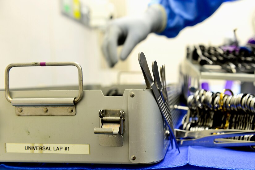 A U.S. Air Force Airman prepares the “clean table” for a doctor prior to surgery at Langley Air Force Base, Va., Oct. 27, 2015. The “clean table” contains surgical pliers, clamps and other essential tools for a successful operation. (U.S. Air Force photo by Airman 1st Class Derek Seifert)