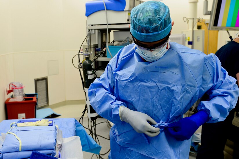 U.S. Air Force Airman 1st Class Gustavo Lombana, 633rd Medical Group surgical technician, prepares to assist in an operation at Langley Air Force Base, Va., Oct. 27, 2015. The role surgical technicians hold in the operation room is to ensure all equipment are sterile. (U.S. Air Force photo by Airman 1st Class Derek Seifert)