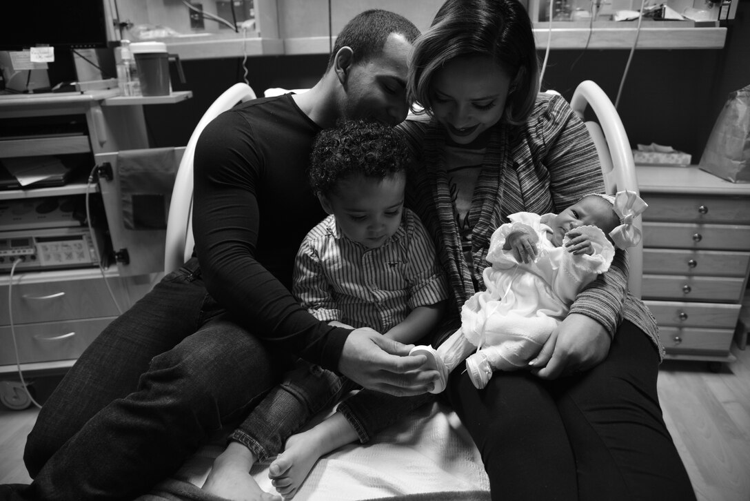 U.S. Army Sgt. Ramon Mota, who assigned to the 53rd Battalion, and his family admire the newest addition to their household, Rosalie Belle Mota-Diaz, at USAF Hospital Langley, Langley Air Force Base, Va., Jan. 1, 2016. Rosalie was the last baby born at the hospital in 2015, and is the Mota-Diaz family’s first daughter, following her two-year-old brother, Ramon Mota, Jr. (U.S. Air Force photo by Senior Airman Aubrey White)