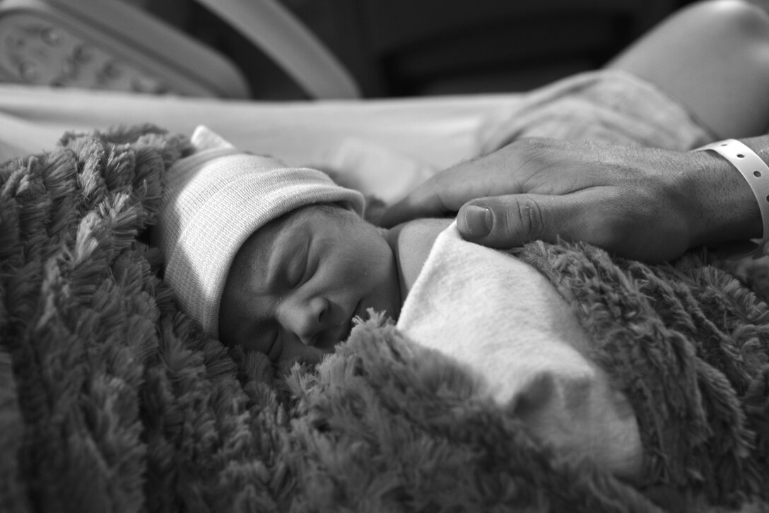 Lia Mae Espinosa, daughter of U.S. Navy Petty Officer 2nd Class Arthur Espinosa, who is assigned to Naval Station Norfolk, Va., rests on her mother’s chest at USAF Hospital Langley, Langley Air Force Base, Va., Jan. 1, 2016. Lia was the first baby born in the New Year at Langley. Lia arrived at 7:39 a.m., weighing 6 lbs 1 oz and measuring 19.2 inches long. (U.S. Air Force photo by Senior Airman Aubrey White)