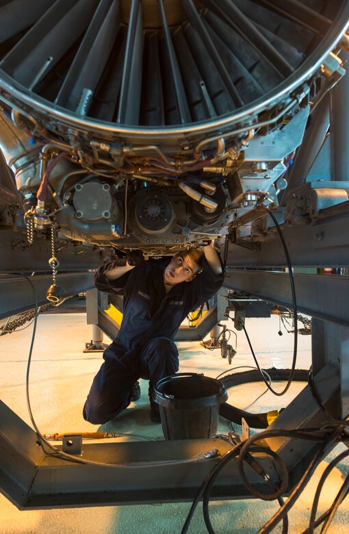 U.S. Air Force Senior Airman Gerald Gangaway, 18th Component Maintenance Squadron journeyman, prepares an F-15 Eagle jet engine to be removed from the test bay Jan. 5, 2016, at the hush house on Kadena Air Base, Japan. F-15 Eagle jet engines are tested after major maintenance before being put back into the aircraft. (U.S. Air Force photo by Senior Airman Omari Bernard)
