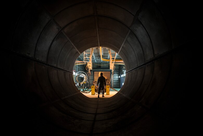 U.S. Air Force Master Sgt. Richard Camacho, 18th Component Maintenance Squadron NCO in charge of test cell, walks through the tunnel used to absorb noise during F-15 Eagle jet engine tests Jan. 5, 2016, inside a bay of the hush house at Kadena Air Base, Japan. The 18th CMS’s hush house provides one of a kind noise abatement that allows the test cell to conduct jet engine tests 24-hours a day without creating external noise. (U.S. Air Force photo by Senior Airman Omari Bernard)