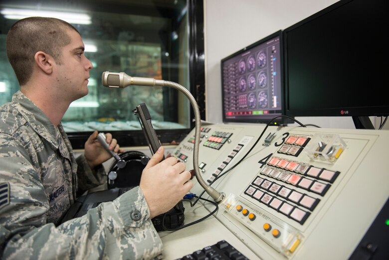 U.S. Air Force Staff Sgt. Donovan Walters, 18th Component Maintenance Squadron craftsman, conducts tests on an F-15 Eagle jet engine from the control room at the hush house Jan. 5, 2016, at Kadena Air Base, Japan. The 18th CMS’s hush house is capable of conducting four engine tests simultaneously with little external noise. (U.S. Air Force photo by Senior Airman Omari Bernard)