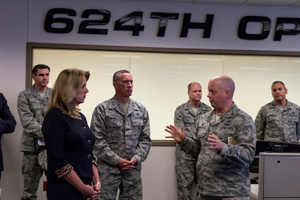Secretary of the Air Force Deborah Lee James receives a briefing from Col. Michael Dombrowski, 624th Operations Center commander during a visit to JBSA - Lackland Jan 5. James and leaders of 24th and 25th Air Force discussed a series of cyber and global ISR initiatives focused on industry partnerships and innovation. (US Air Force photo by MSgt Luke Thelen)