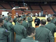 Members of the 435th Fighter Training Squadron engage in a full-court discussion with Shaka Smart, head coach of the University of Texas men’s basketball team, 19 Nov. 2015 at the UT basketball stadium. The Deadly Black Eagles met with the coach to discuss building relationships within a team and leadership philosophies. (Courtesy photo)