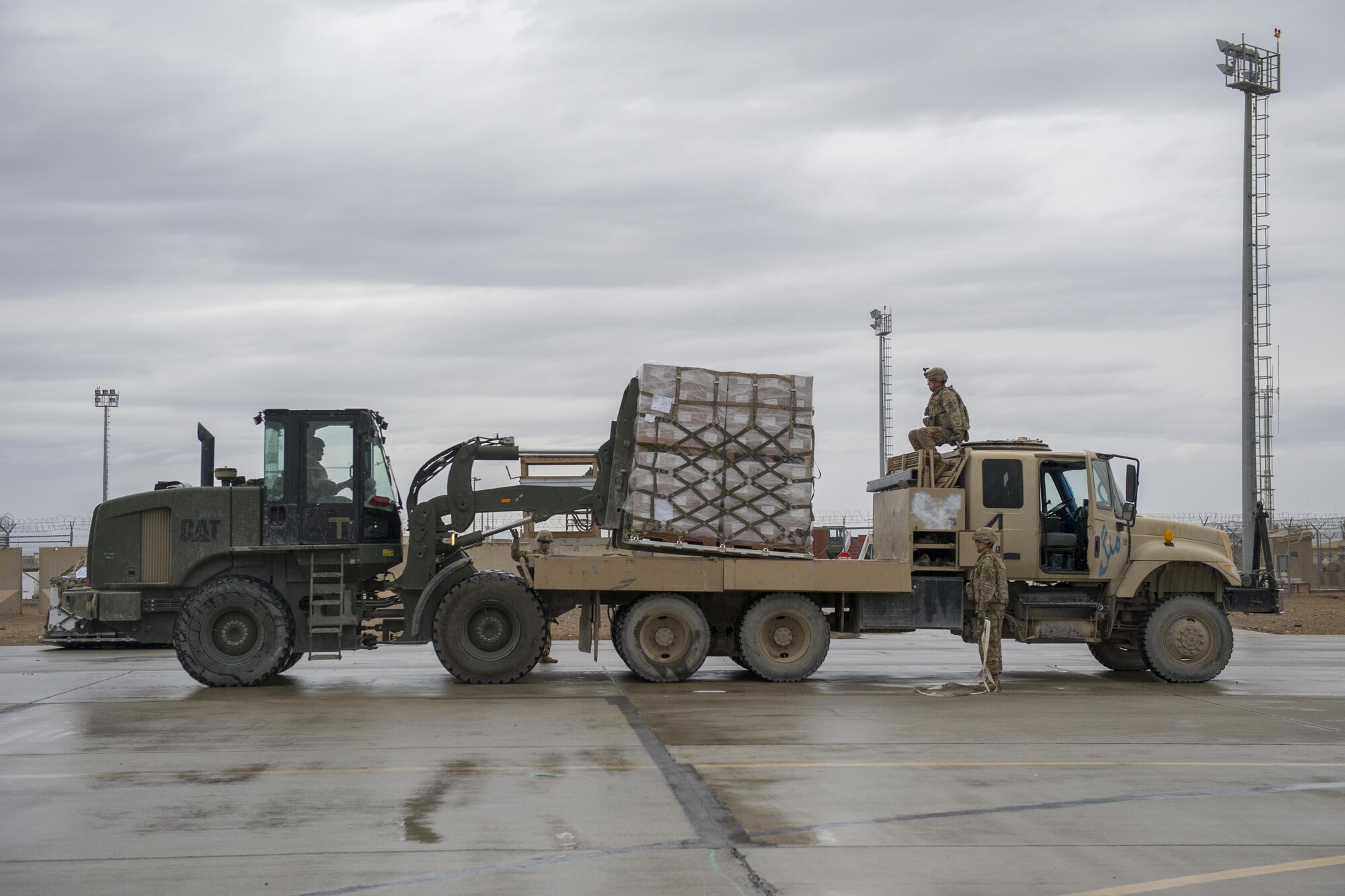 A Central Command Materiel Recovery Element team member loads cargo on to the bed of a truck after removing it from a C-130J Super Hercules at Camp Bastion, Afghanistan, Jan. 3, 2016. The CMRE team is designed to account for and redeploy war reserve assets after they have fulfilled their intended purpose, so they are available for use elsewhere. (U.S. Air Force photo/Tech. Sgt. Robert Cloys)