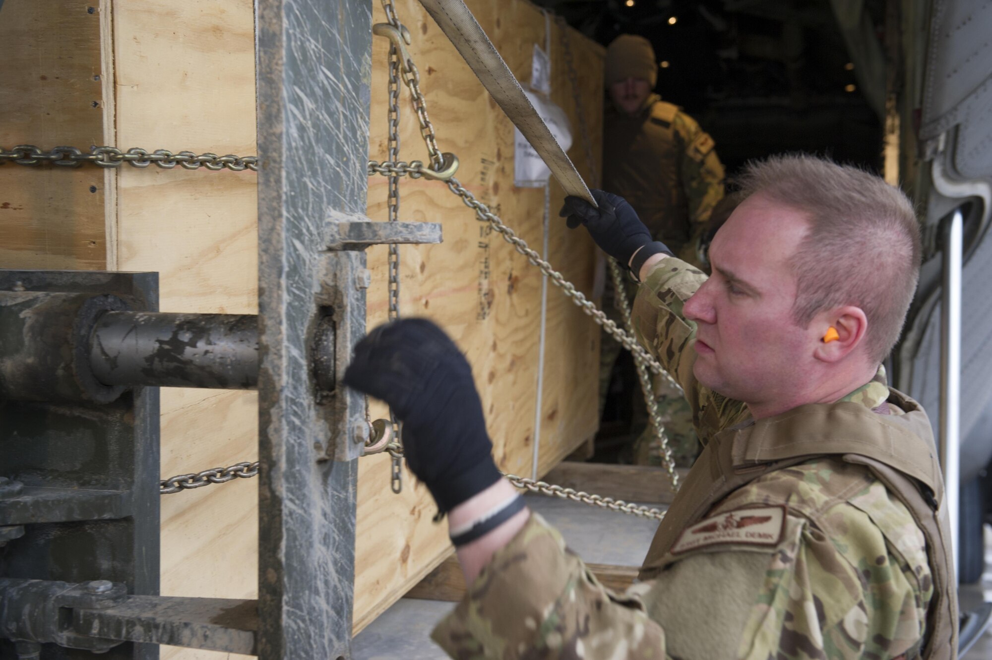 Staff Sgt. Michael Demik, 774th Expeditionary Airlift Squadron loadmaster, deployed from Dyess Air Force Base, Texas, checks cargo being loaded on to a forklift at Camp Bastion, Afghanistan, Jan. 3, 2016. Loadmasters are responsible for calculating aircraft weight, balancing records and cargo manifests, conducting cargo and personnel airdrops, and troubleshooting in-flight problems. (U.S. Air Force photo/Tech. Sgt. Robert Cloys)