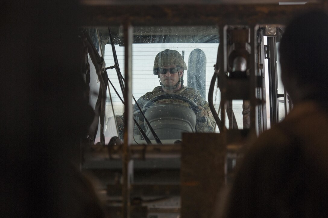 Master Sgt. Jason Hixon, Central Command Materiel Recovery Element team member, uses a forklift to move cargo from a C-130J Super Hercules at Camp Bastion, Afghanistan, Jan. 3, 2016. The CMRE team is designed to account for and redeploy war reserve assets after they have fulfilled their intended purpose, so they are available for use elsewhere. (U.S. Air Force photo/Tech. Sgt. Robert Cloys)