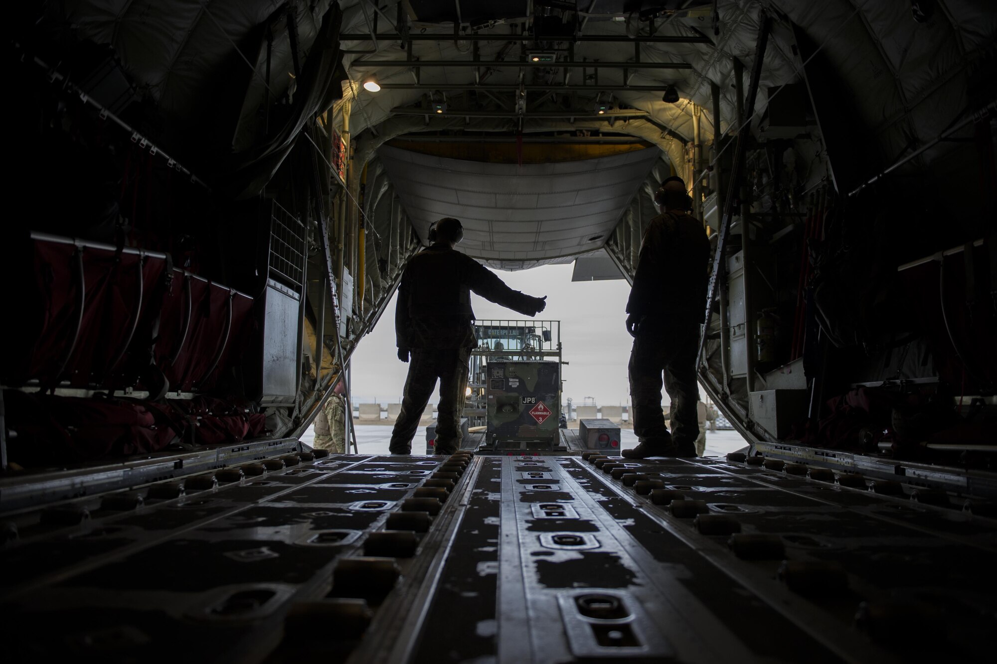Staff Sgt. Scott McGuire, 774th Expeditionary Airlift Squadron loadmaster, deployed from Dyess Air Force Base, Texas, gives a thumbs up after a generator is removed from a C-130J Super Hercules at Camp Bastion, Afghanistan, Jan. 3, 2016. Loadmasters are responsible for calculating aircraft weight, balancing records and cargo manifests, conducting cargo and personnel airdrops, and troubleshooting in-flight problems. (U.S. Air Force photo/Tech. Sgt. Robert Cloys)