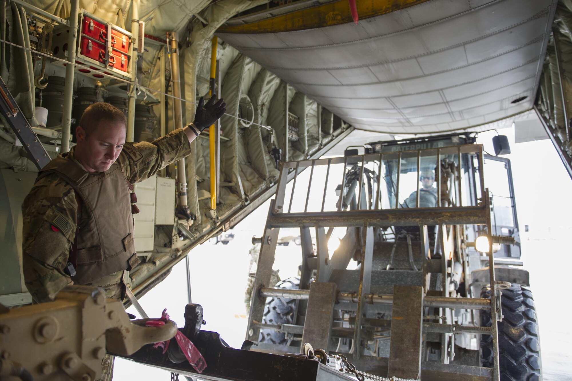 Staff Sgt. Michael Demik, 774th Expeditionary Airlift Squadron loadmaster, deployed from Dyess Air Force Base, Texas, guides a forklift at Camp Bastion, Afghanistan, Jan. 3, 2016. Loadmasters are responsible for calculating aircraft weight, balancing records and cargo manifests, conducting cargo and personnel airdrops, and troubleshooting in-flight problems. (U.S. Air Force photo/Tech. Sgt. Robert Cloys)