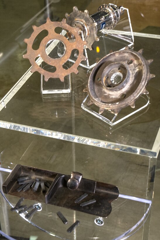 This bicycle sprocket hub and sprockets from the Wright Bicycle Co. are on display at the National Museum of the United States Air Force. The Wrights later used a bicycle-type chain drive in their early airplanes. Also on display are a composting stick and metal type from the Wright printing business.