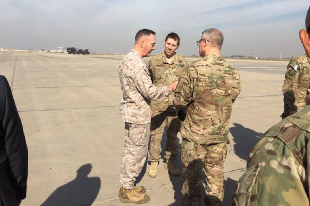 U.S. Marine Corps Gen. Joseph F. Dunford Jr., left, chairman of the Joint Chiefs of Staff, arrives in Iraq for talks with U.S. and Iraqi leaders.  DoD photo