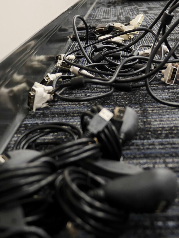 Computer cables laying on the floor prior to being installed on systems in a new classroom at the Defense Information School on Fort Meade, Md., Jan. 7, 2016. The IT team led the effort to plan and execute the successful running of 236.2 miles of cable, installation of 1,978 data drops and 450 phone drops, and the transfer of 2,400 computer systems from south campus to the main campus to prepare for training in the new wing.